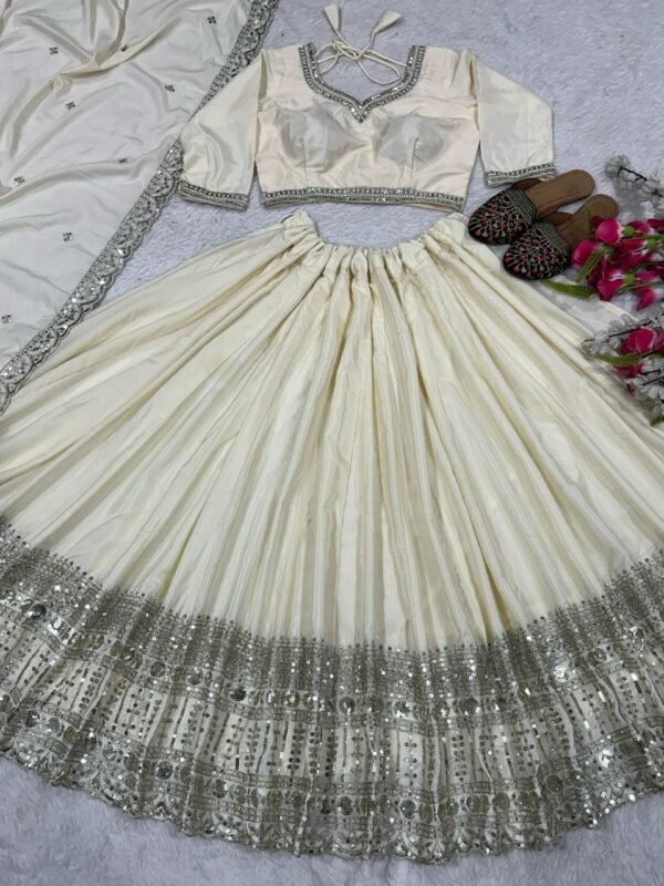 White Elegant soft look lehenga gold sequence