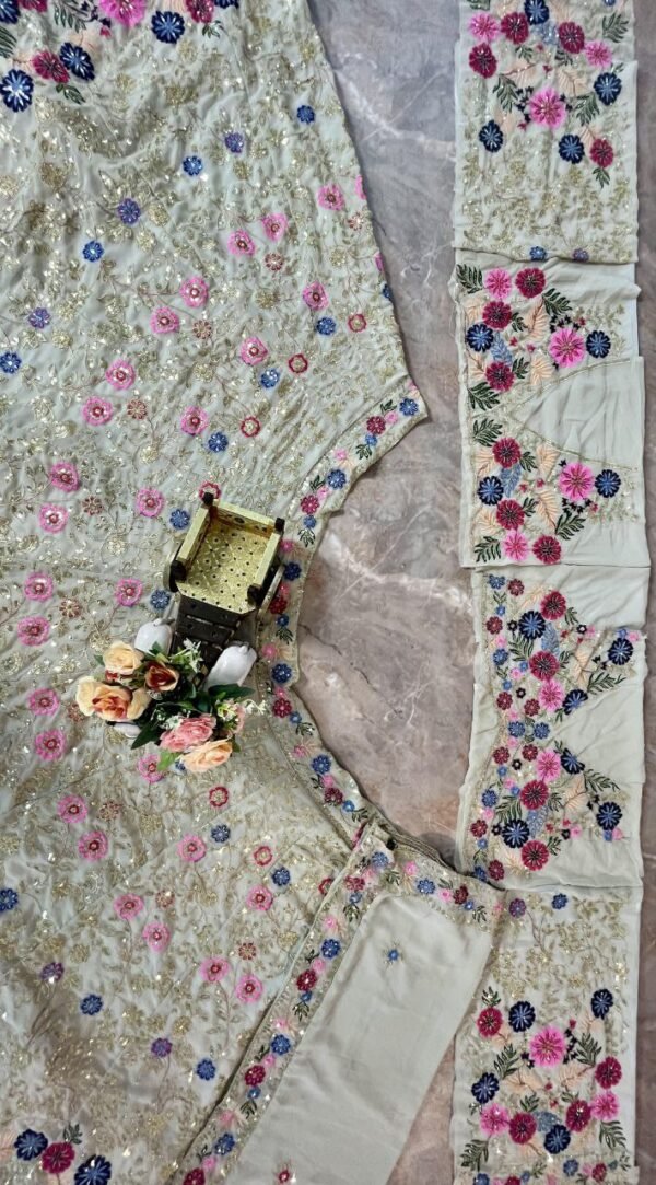 White dinner bridal lehenga colourful floral pattern