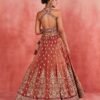 Dusty orange skirt with deep red blouse dinner lehenga
